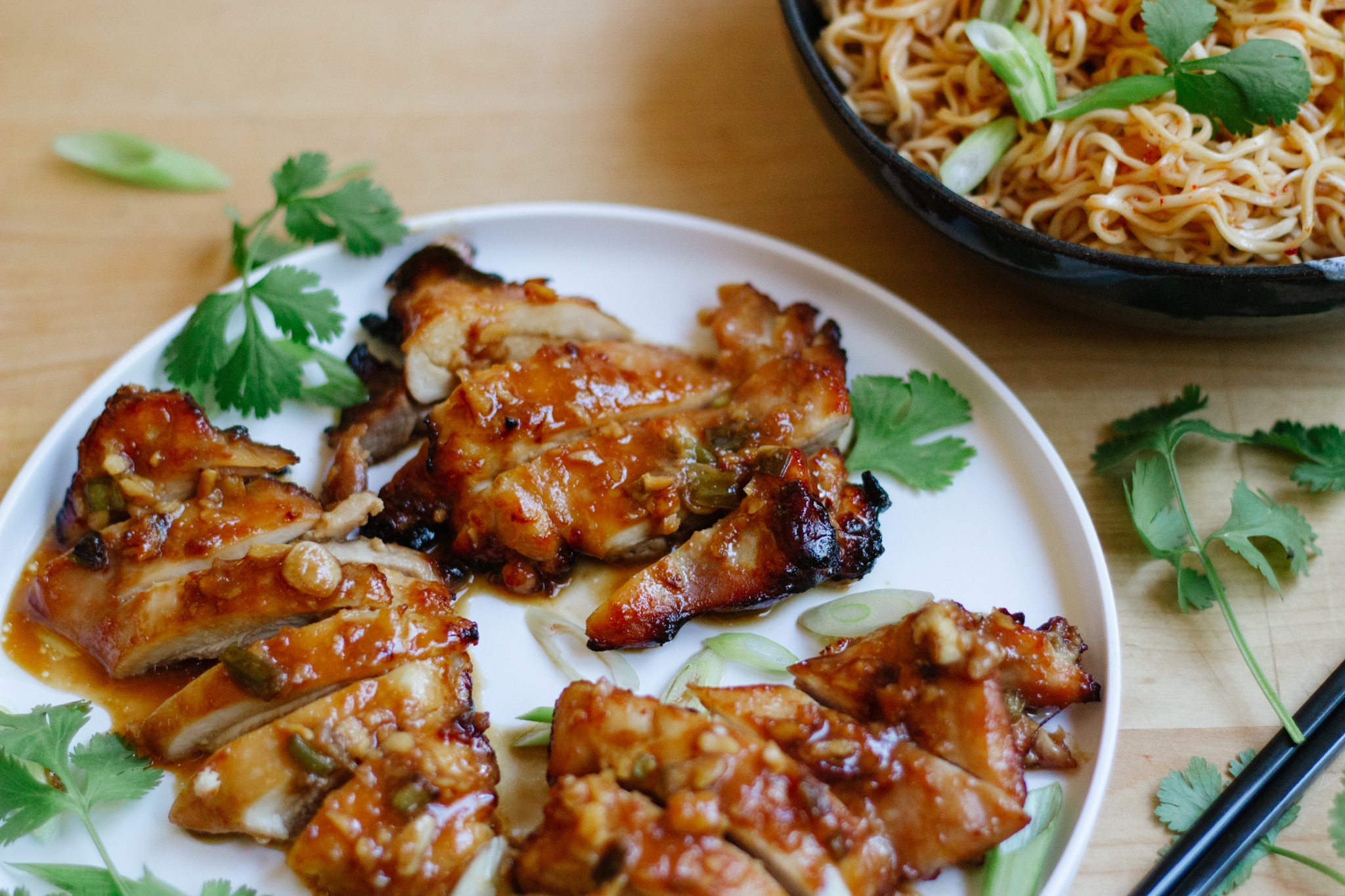 air fried boneless skinless chicken thighs with miso marinade garnished with cilantro